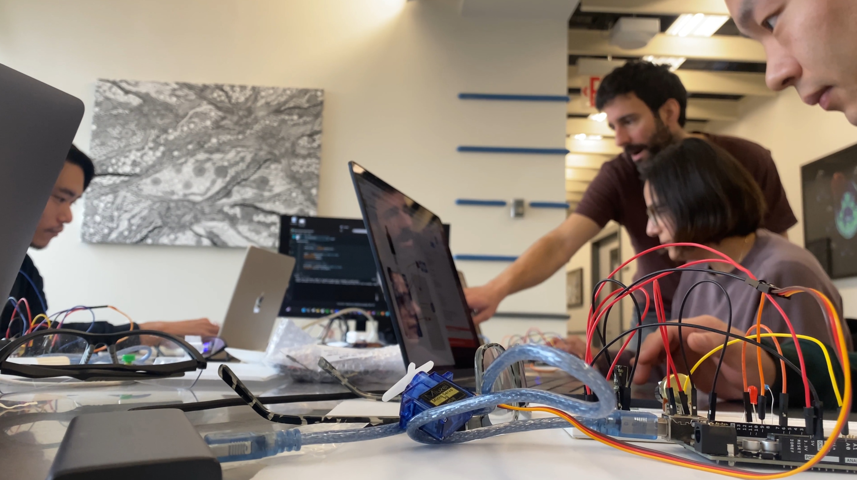 Participants working together during an electronics workshop